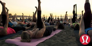 Lululemon hosts a yoga class on the beach 